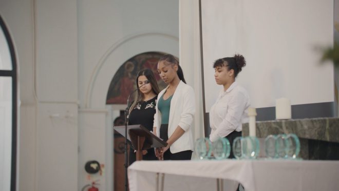Three St. John's Bosco students win an award at the end of the programme.
