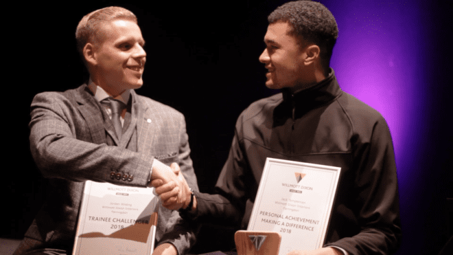 Willmott Dixon staff receive certificate at Willmott Dixon Foundation Award.