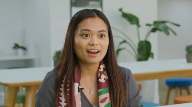 professional at Alix Partners talking in office
