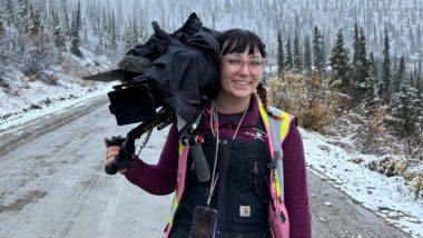 Camera operator woman in snow