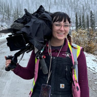 Camera operator woman in snow